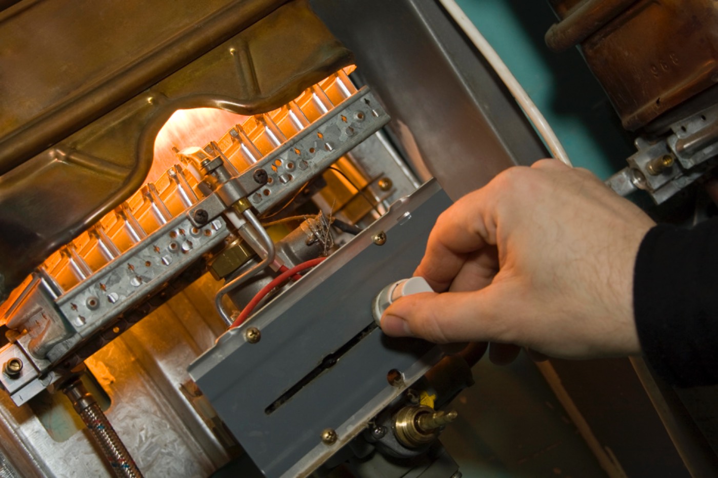 Close-up of a Hixon technician servicing a gas furnace near Lawrenceville, GA